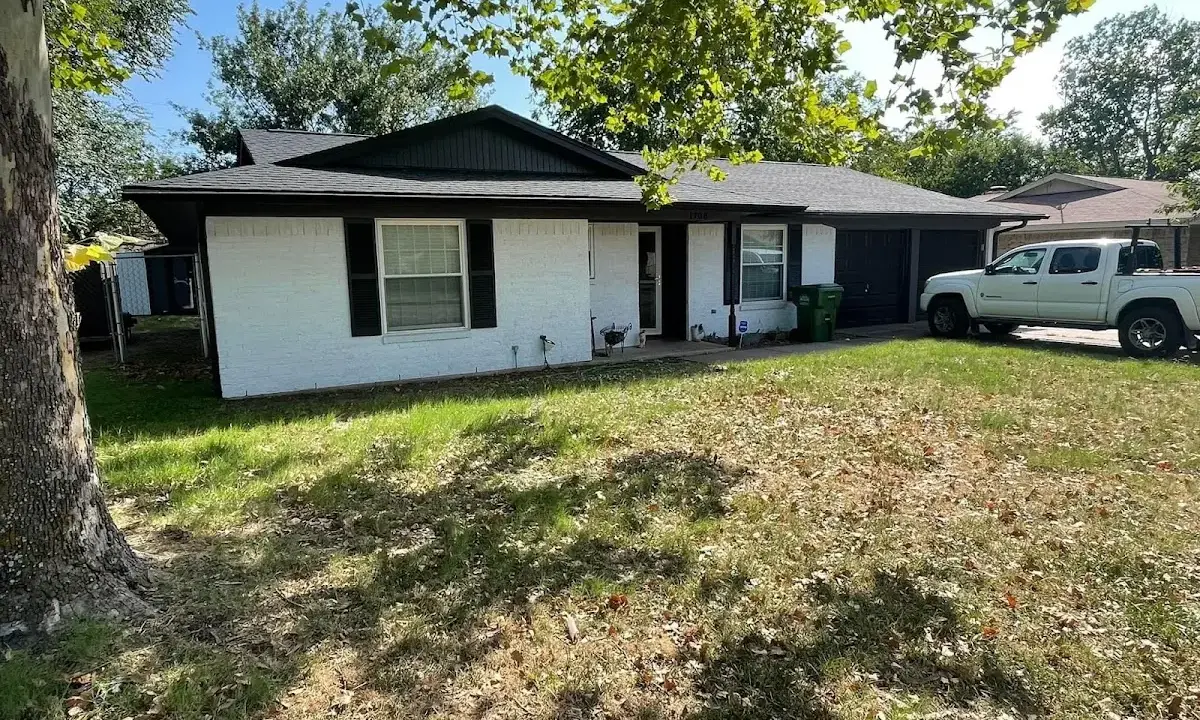 Professional roofing crew working on a residential roof in Willows